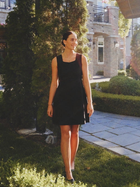 Woman wearing the Ryssa Little Black Dress